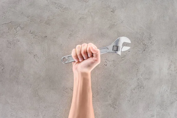Cropped Shot Man Holding Pipe Wrench Concrete Surface — Stock Photo, Image
