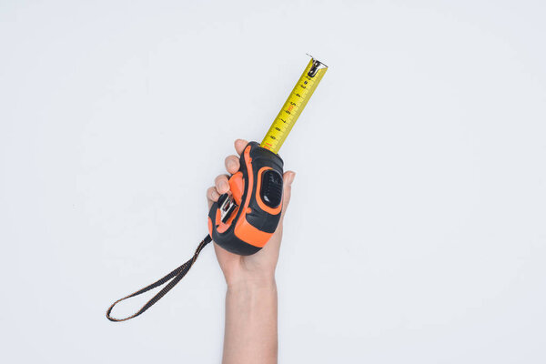 cropped shot of woman holding measuring tape tool isolated on white