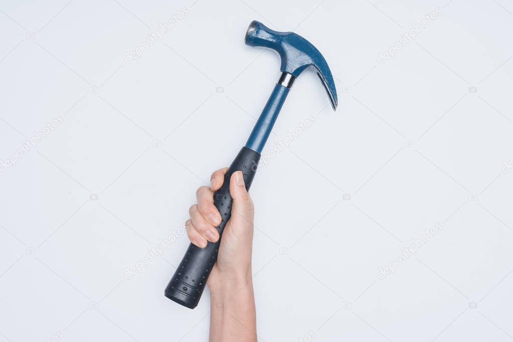 cropped shot of woman holding hammer isolated on white