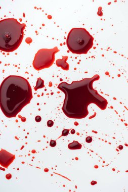 top view of messy blood droplets on white surface clipart