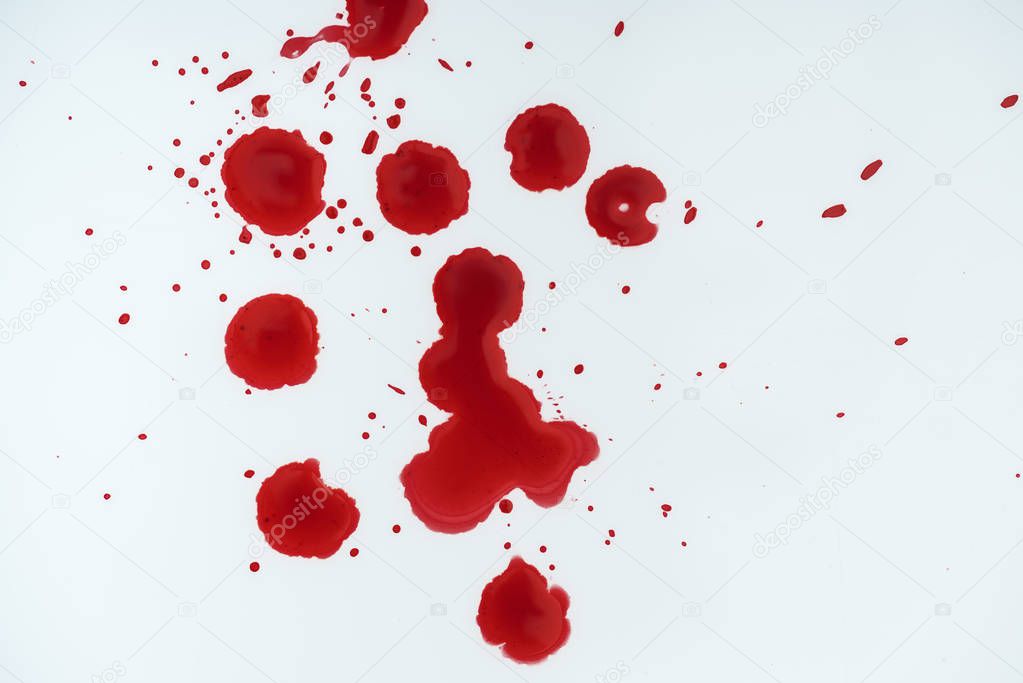 top view of white surface covered with blood blots