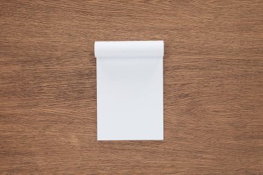 top view of blank notebook on wooden background clipart