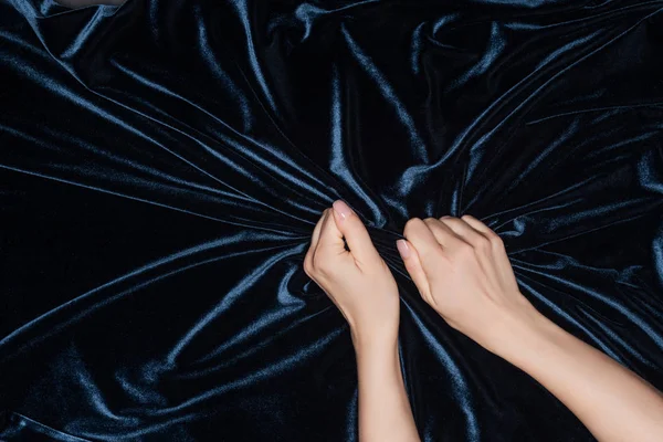 Close Female Hands Tightly Holding Black Shiny Velvet Cloth — Stock Photo, Image