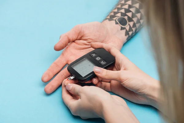 Close View Woman Testing Man Blood Sugar Level Glucometer Blue — Stock Photo, Image