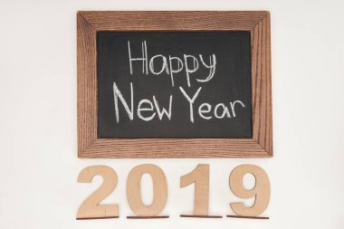 top view of 'happy new year' text on chalk board with 2019 date made of plywood isolated on white clipart