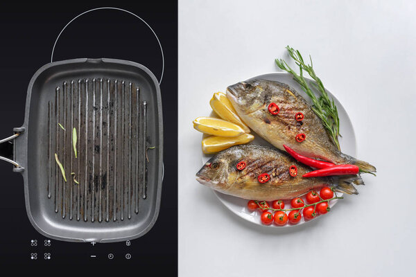 delicious fried fish with cherry tomatoes, rosemary, chili peppers and lemon on plate and grill on electric stove
