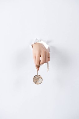 cropped image of woman holding hand with beautiful luxury round locket with marble through white paper clipart