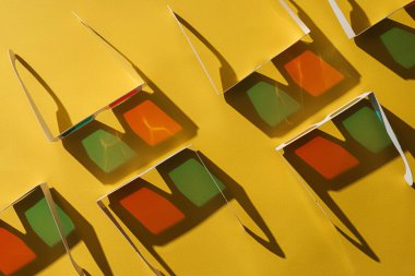 top view of 3d glasses with shadows on yellow background clipart