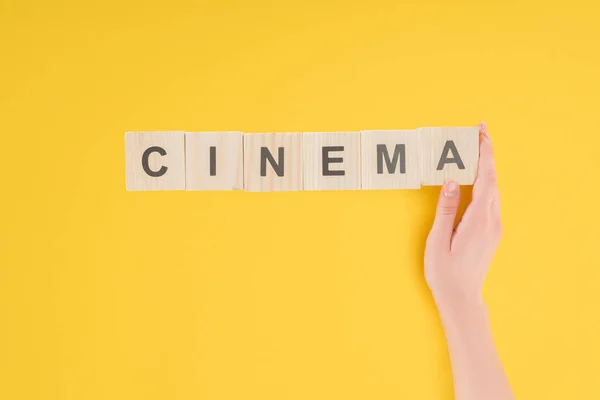 Top View Female Hand Touching Wooden Cubes Cinema Lettering Isolated — Stock Photo, Image