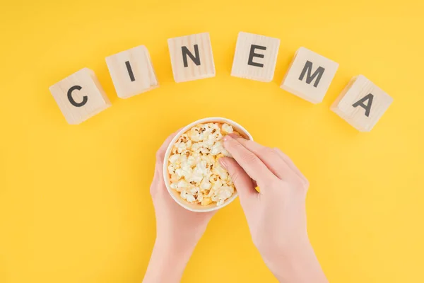 Top View Wooden Cubes Cinema Lettering Hands Holding Bucket Taking — Free Stock Photo