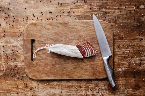 Top View Cutting Board Steel Knife Tasty Sliced Salami Wooden — Stock Photo, Image