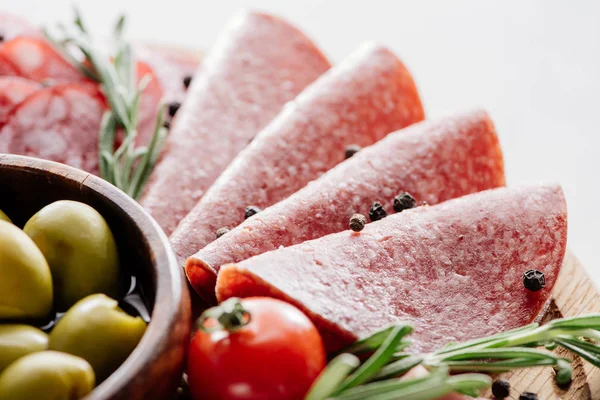 Close View Tasty Olives Bowl Sliced Salami Tomato Herbs Wooden — Stock Photo, Image