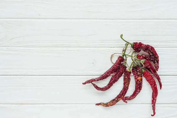 Bundle Red Chilli Peppers White Wooden Background Copy Space — Stock Photo, Image