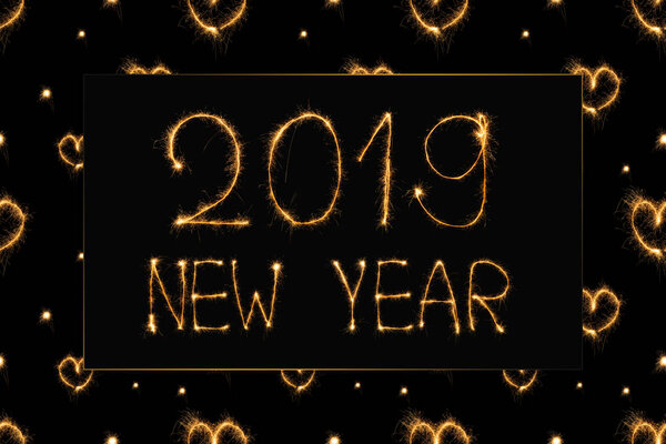 2019 new year light lettering and hearts light signs on black background