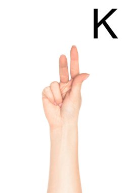 partial view of woman showing latin letter - K, deaf and dumb language, isolated on white clipart