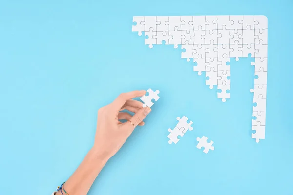 Cropped Shot Woman Holding White Puzzles Piece Blue Background — Stock Photo, Image