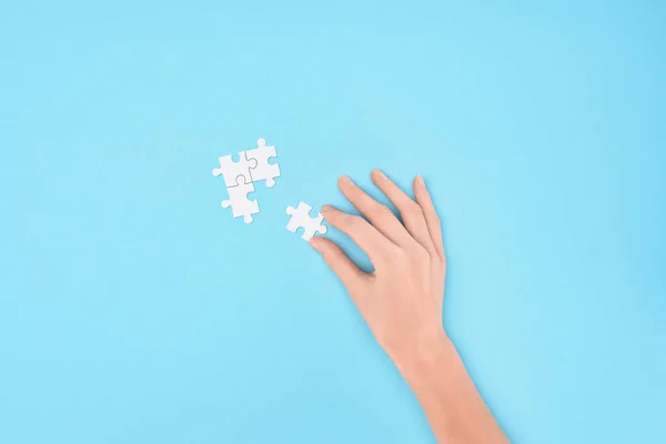 Cropped Shot Woman White Puzzles Pieces Blue Background — Stock Photo, Image