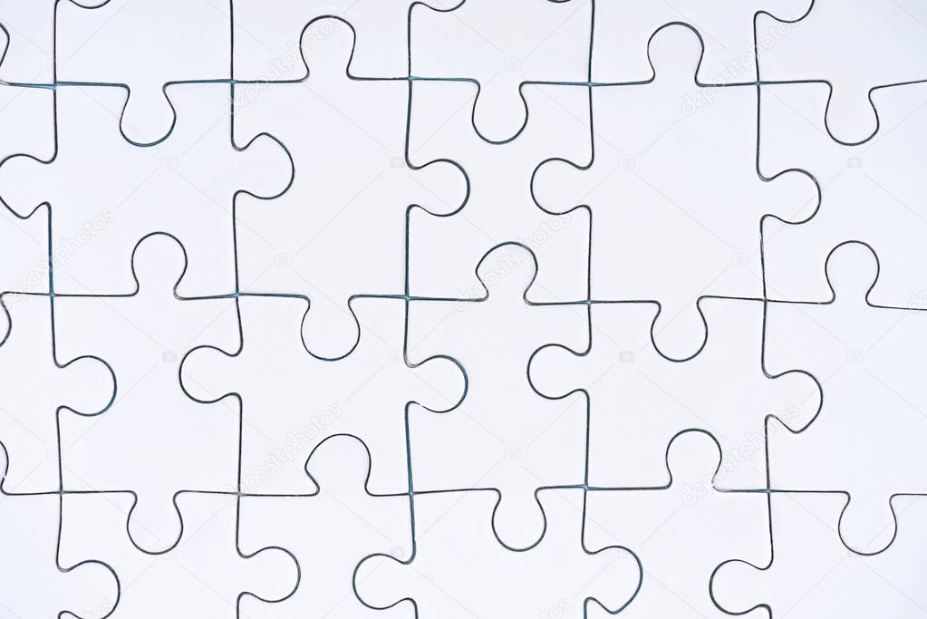 full frame of white puzzle pieces background