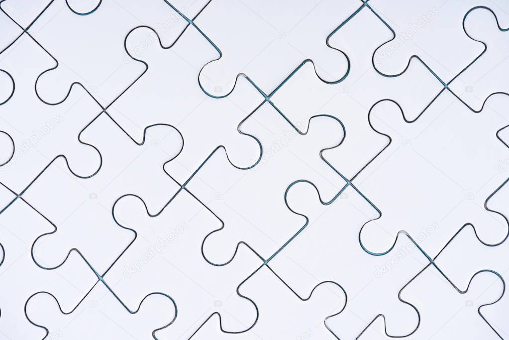 full frame of arranged white puzzles background