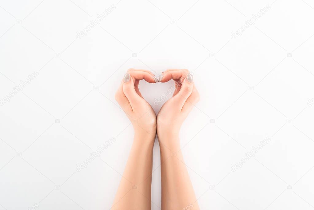 cropped image of woman making heart symbol by hands, st valentine day concept 