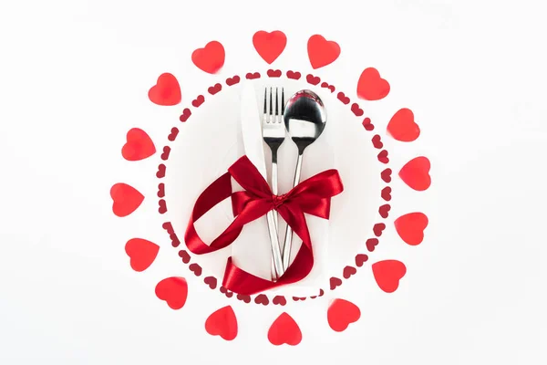 Top View Cutlery Wrapped Red Festive Ribbon Surrounded Heart Symbols — Stock Photo, Image