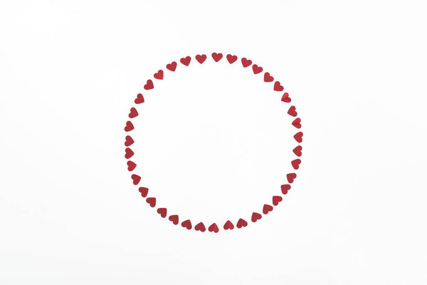 elevated view of circle made of red heart symbols isolated on white, st valentine day concept