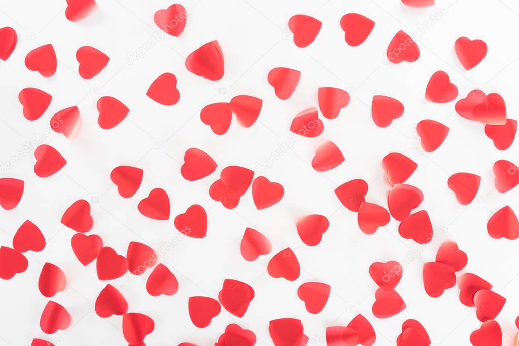 view from above of red heart symbols isolated on white, st valentine day concept