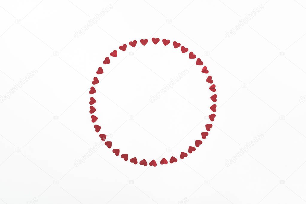 elevated view of circle made of red heart symbols isolated on white, st valentine day concept