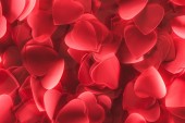 close-up view of romantic decorative red heart shaped petals, valentines day background     