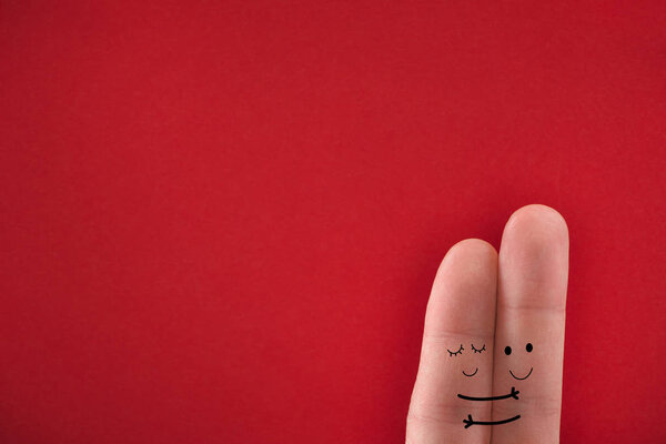 Painted fingers pretending happy couple in love hugging. Valentines day concept. 