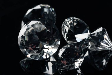close up of collection of pure shiny diamonds isolated on black clipart