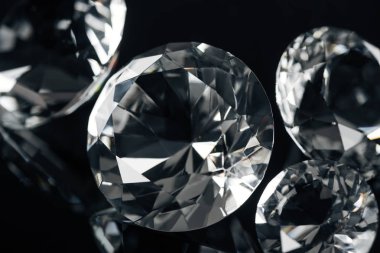 collection of clear diamonds isolated on black clipart