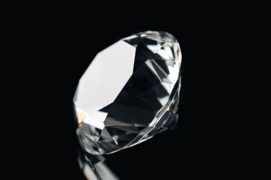 pure shiny diamond isolated on black clipart