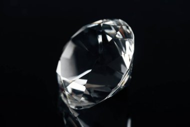 pure expensive diamond isolated on black clipart