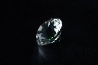 clear big diamond on black background clipart