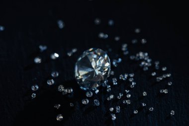 big and small clear diamonds isolated on black clipart
