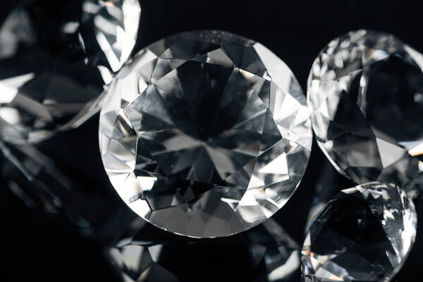collection of pure shiny diamonds isolated on black