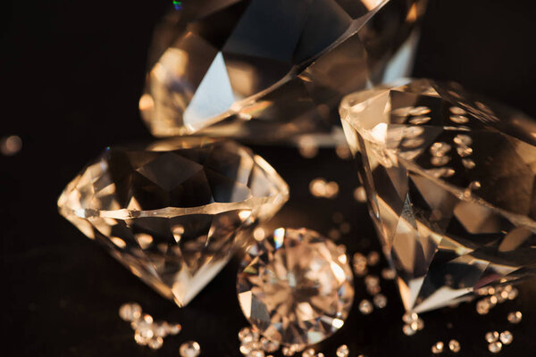 close up of pure golden diamonds isolated on black