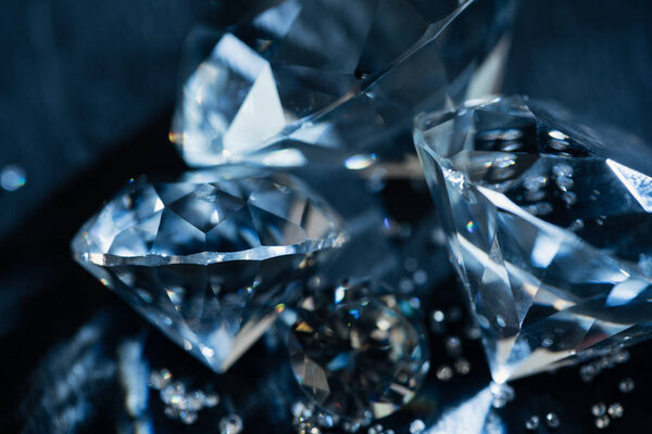 close up of transparent pure diamonds on black background
