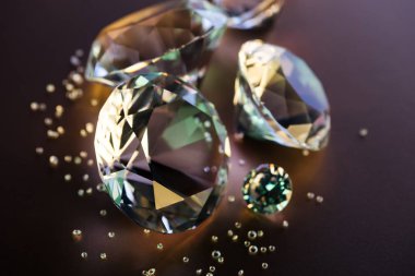 selective focus of clear diamonds on brown background clipart