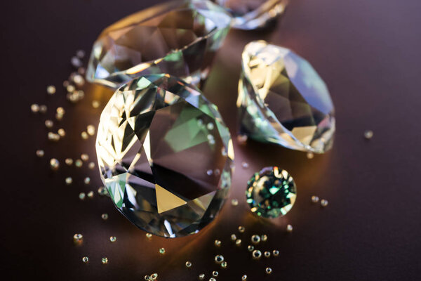 selective focus of clear diamonds on brown background