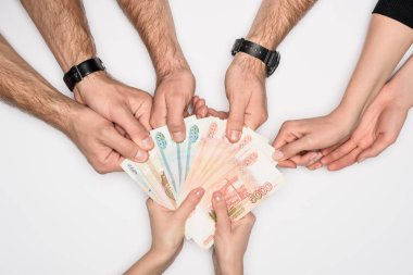 cropped view of group sharing Russian banknotes isolated on grey clipart