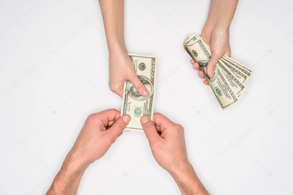 cropped view of woman giving man money isolated on grey