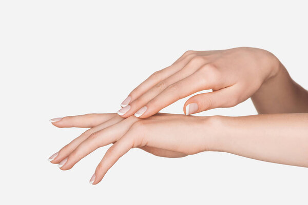partial view of female hands isolated on white