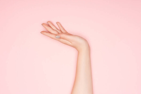 cropped view of female hand with copy space isolated on pink