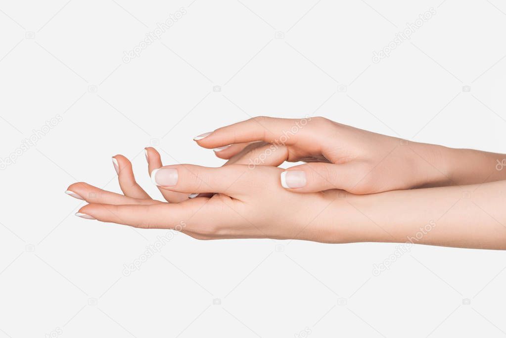 cropped view of female hands isolated on white