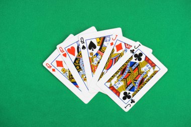 top view of green poker table with unfolded playing cards, three queens and  two jacks clipart