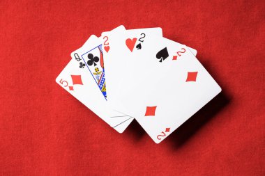 top view of red poker table and playing cards combination with different suits clipart