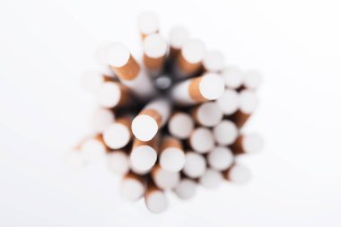 Top view of cigarettes with selective focus isolated on white clipart