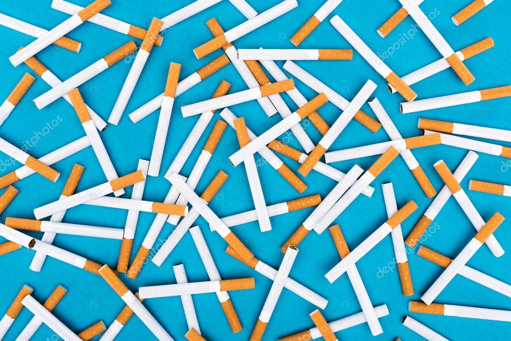 Studio shot of cigarettes isolated on blue 